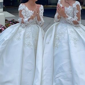 2 beautiful white dresses for kids never used and brand new.